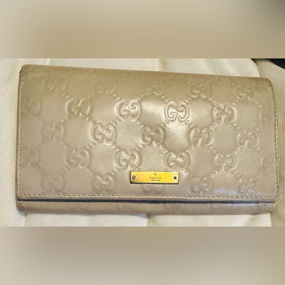 Gucci Handbags - Gucci Cream Guccissima Embossed Leather Flap Continental Wallet GUC